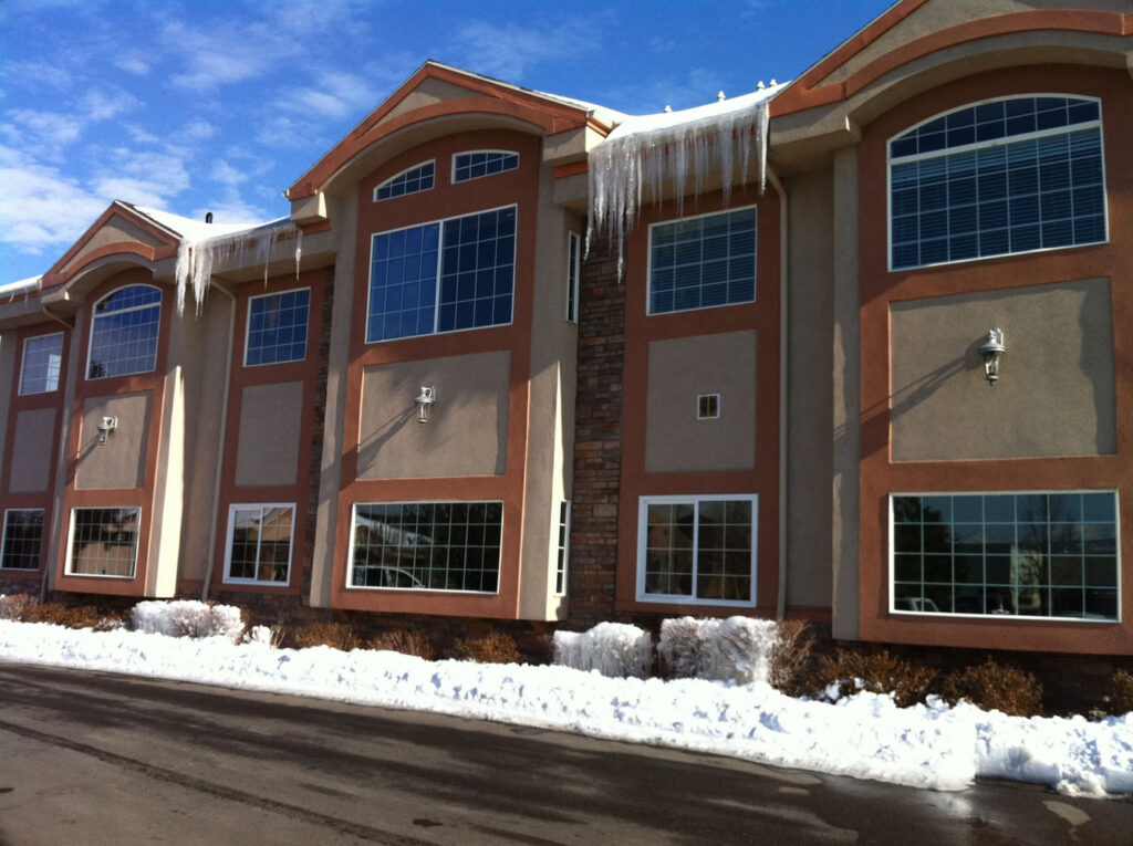 A commercial building with snow and ice