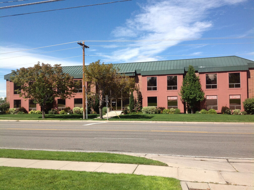 A large building with pink red walls