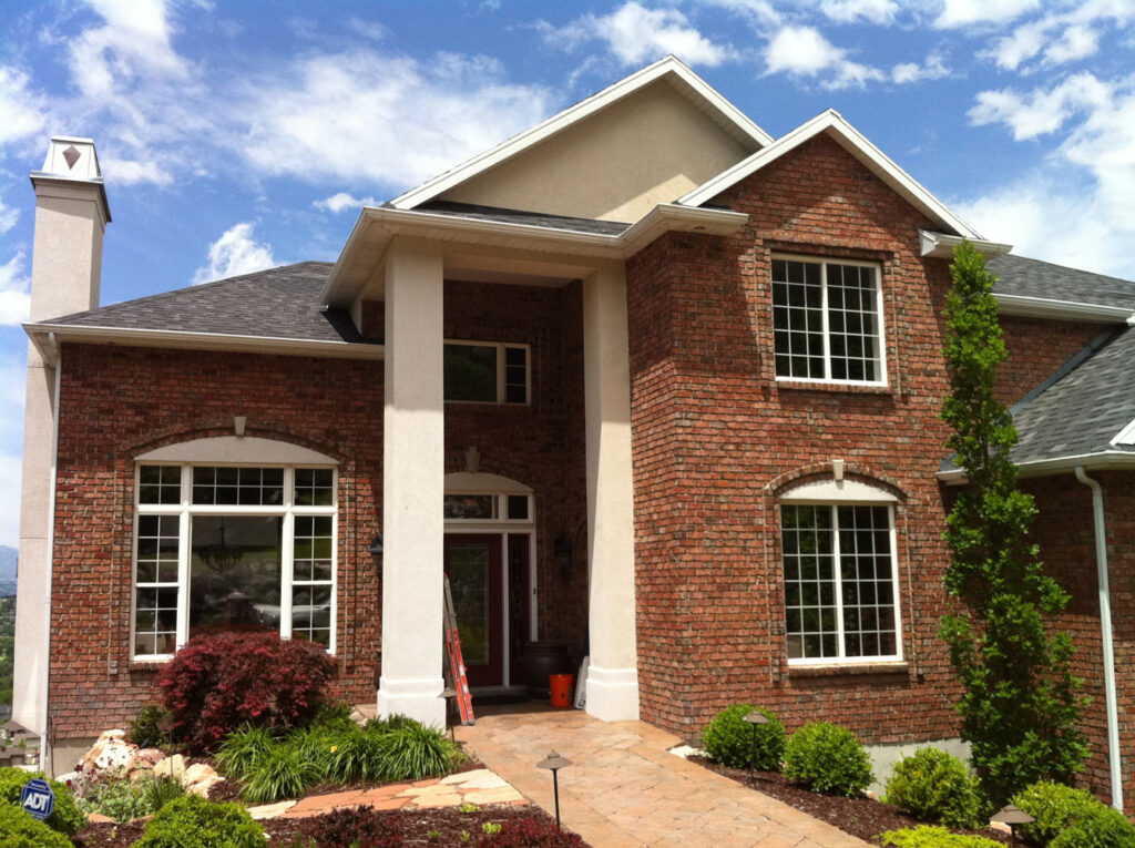 A house with brick walls and reflective windows