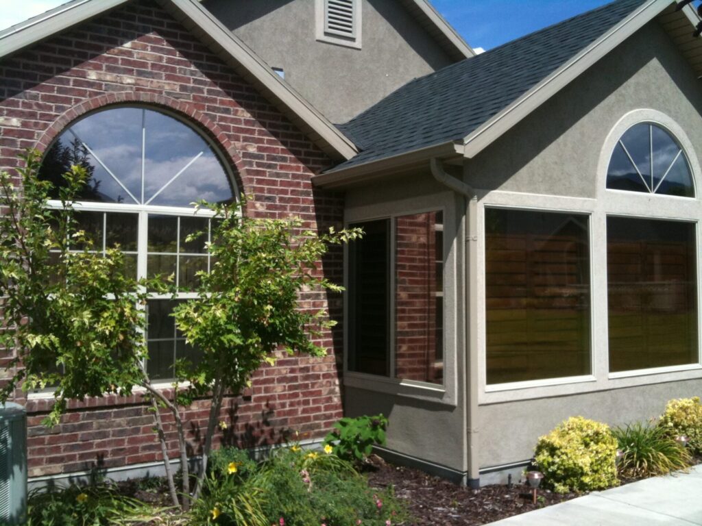 A house with dark brown tinted windows