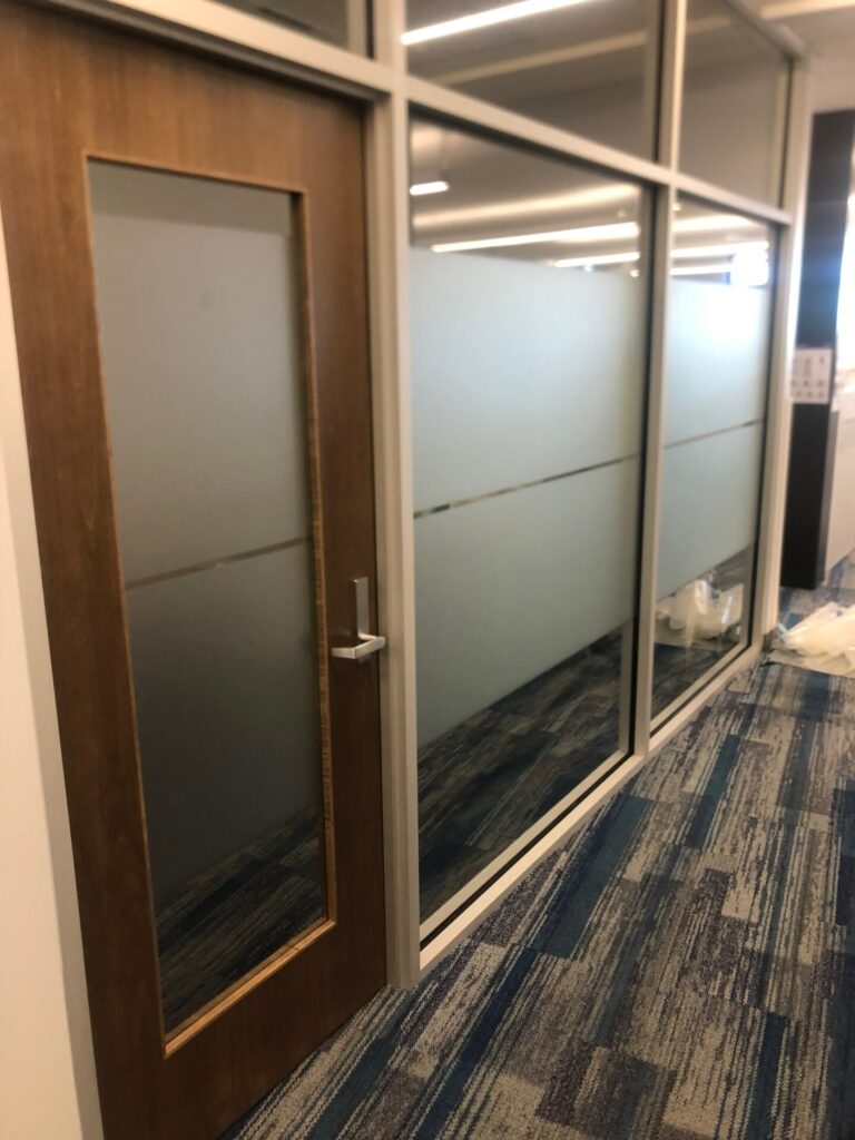 Two wide security films covering glass doors and barriers